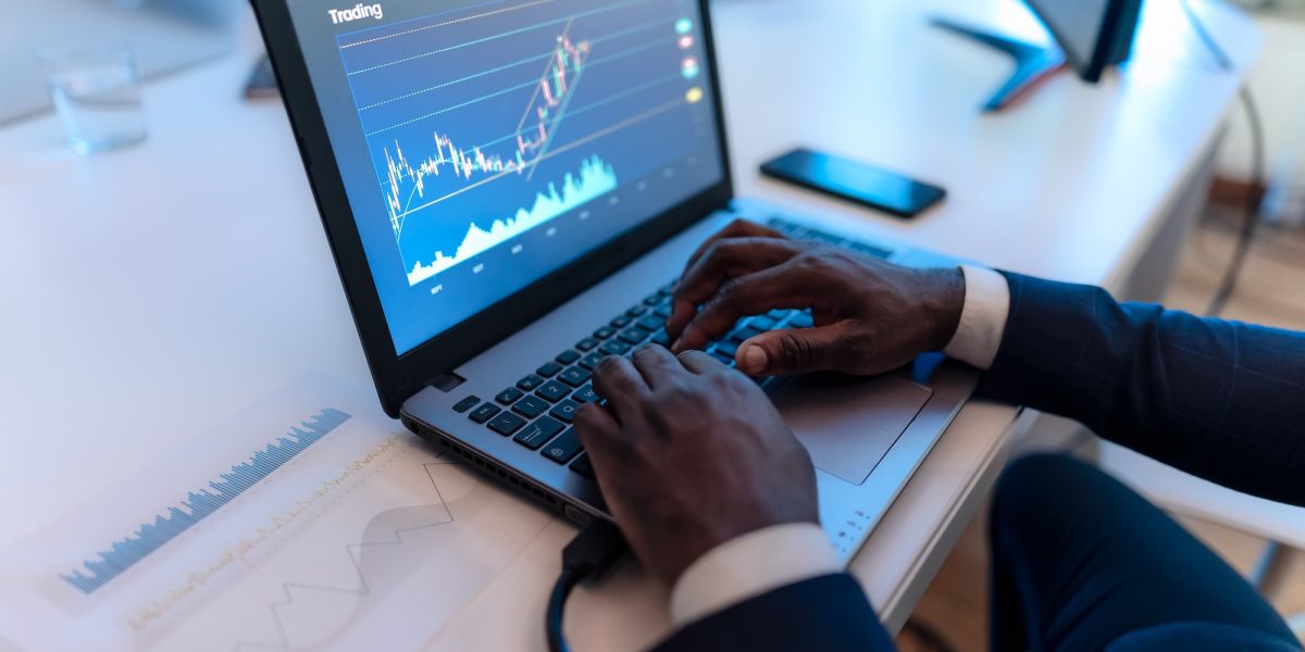 Close up of business trader man working on crypto currency markets with blockchain technology