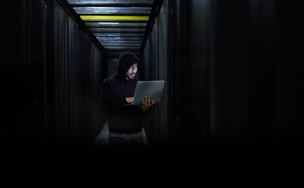Man with laptop, hacker and dark web for cyber security, server and browse internet. Hacker, male s