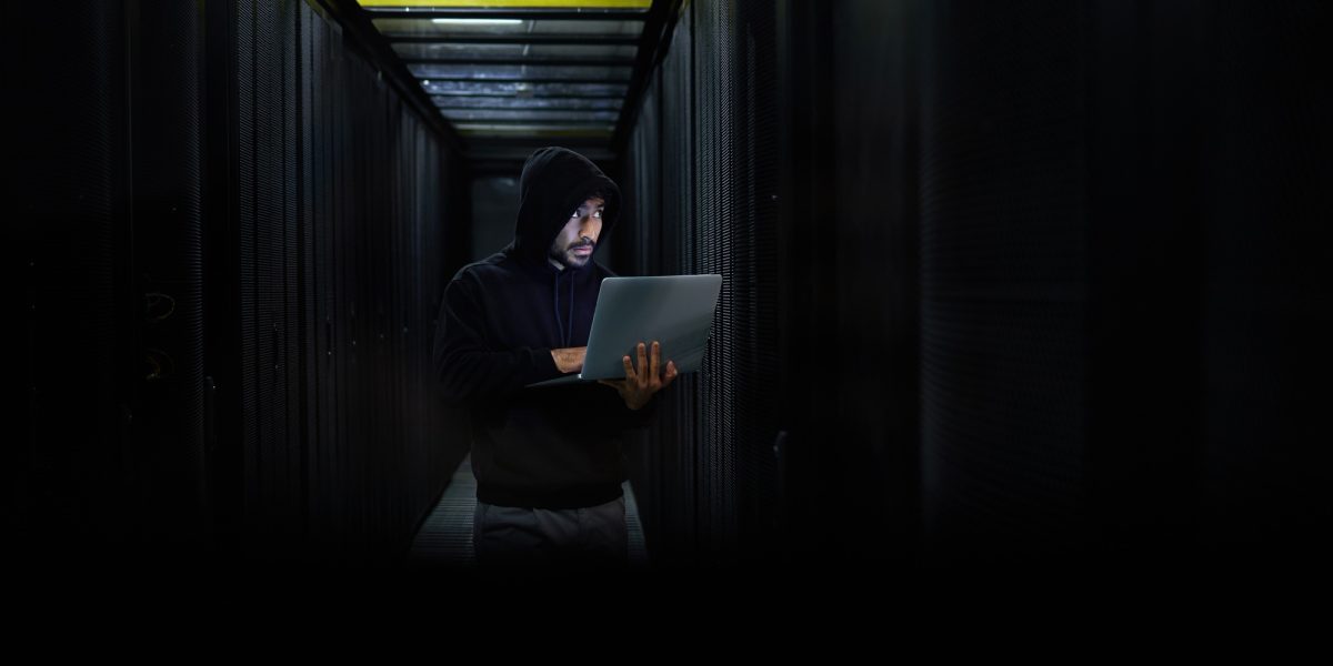 Man with laptop, hacker and dark web for cyber security, server and browse internet. Hacker, male s