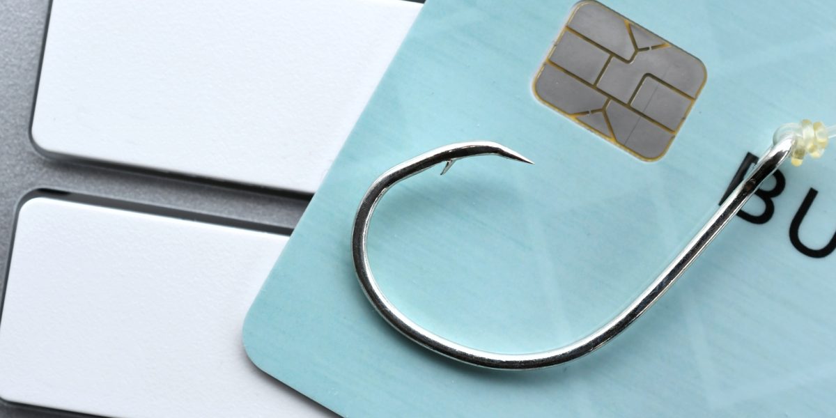 Phishing email scam fraud identity theft - credit card fishing hook blank computer keyboard mock up