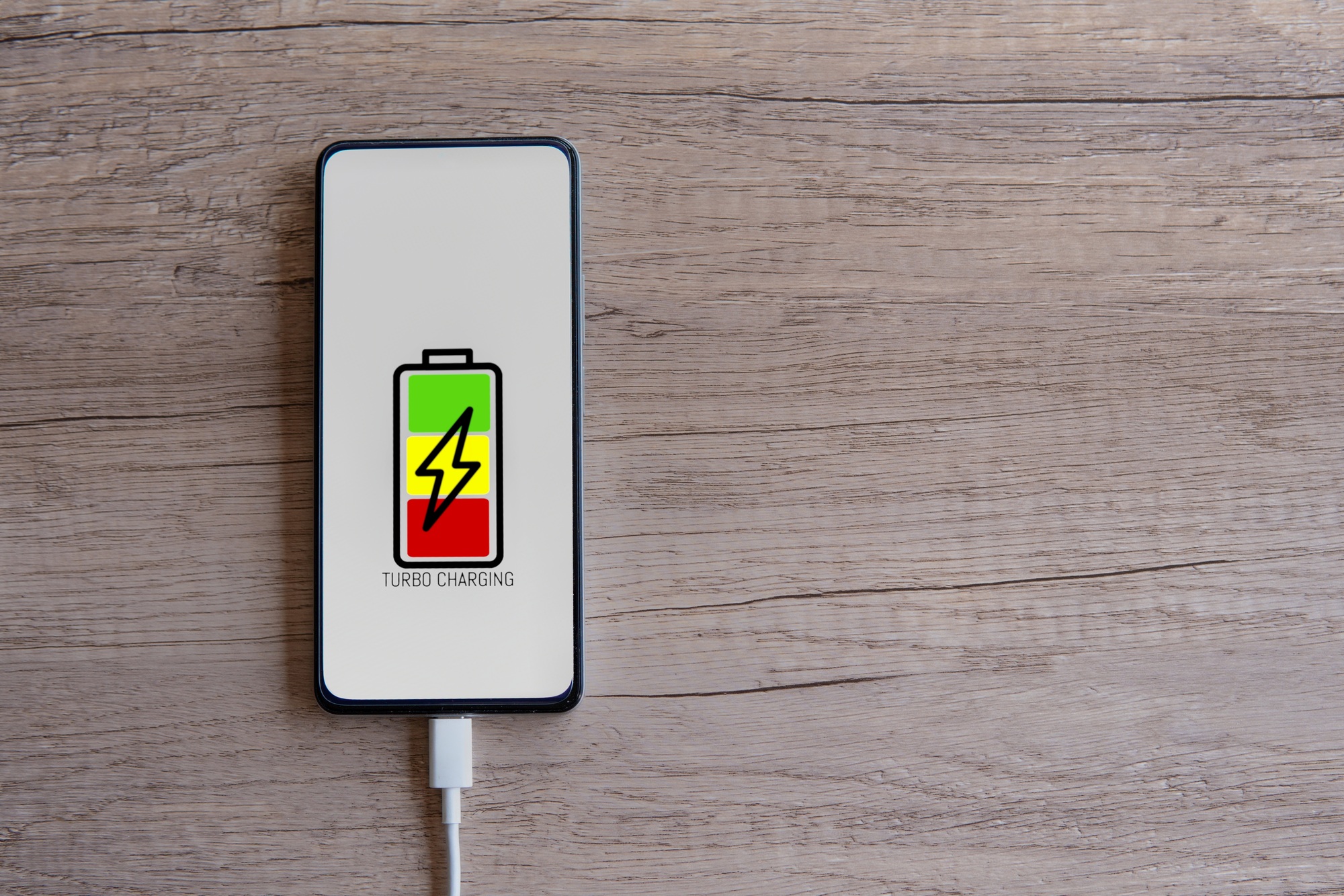 Top view image of smartphone with turbo charging.